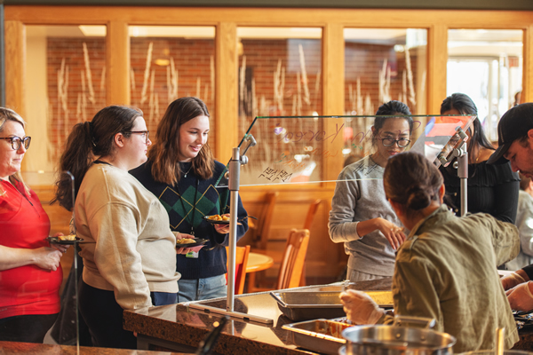 Students waiting in line for their food